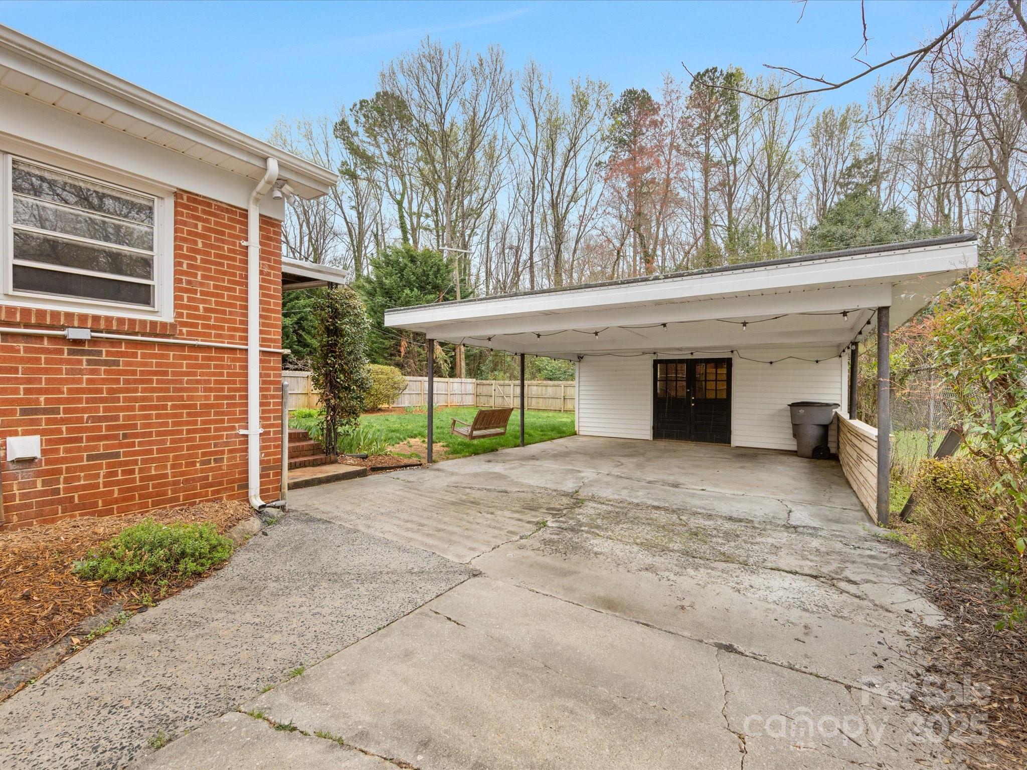 2908 Enfield Road Charlotte, NC 28205 - Photo 29 of 32 a view of a house with a yard and garage