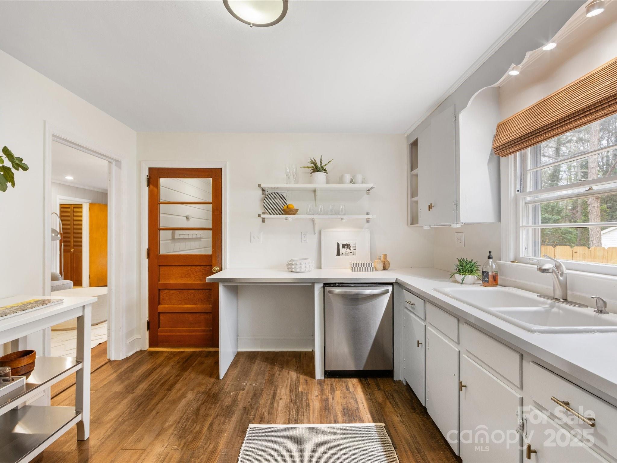 2908 Enfield Road Charlotte, NC 28205 - Photo 7 of 32 a kitchen with a sink and cabinets