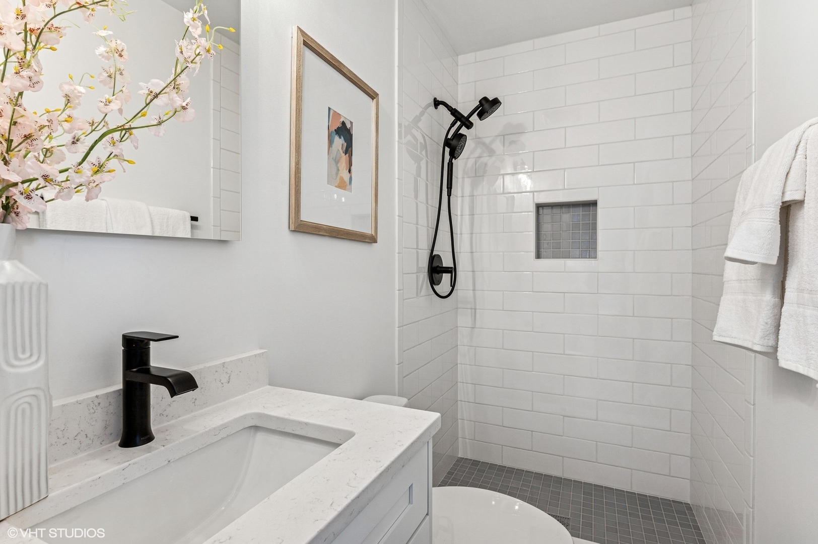 739 Echo Lane Glenview, IL 60025 - Photo 11 of 27 a bathroom with a sink a toilet and shower