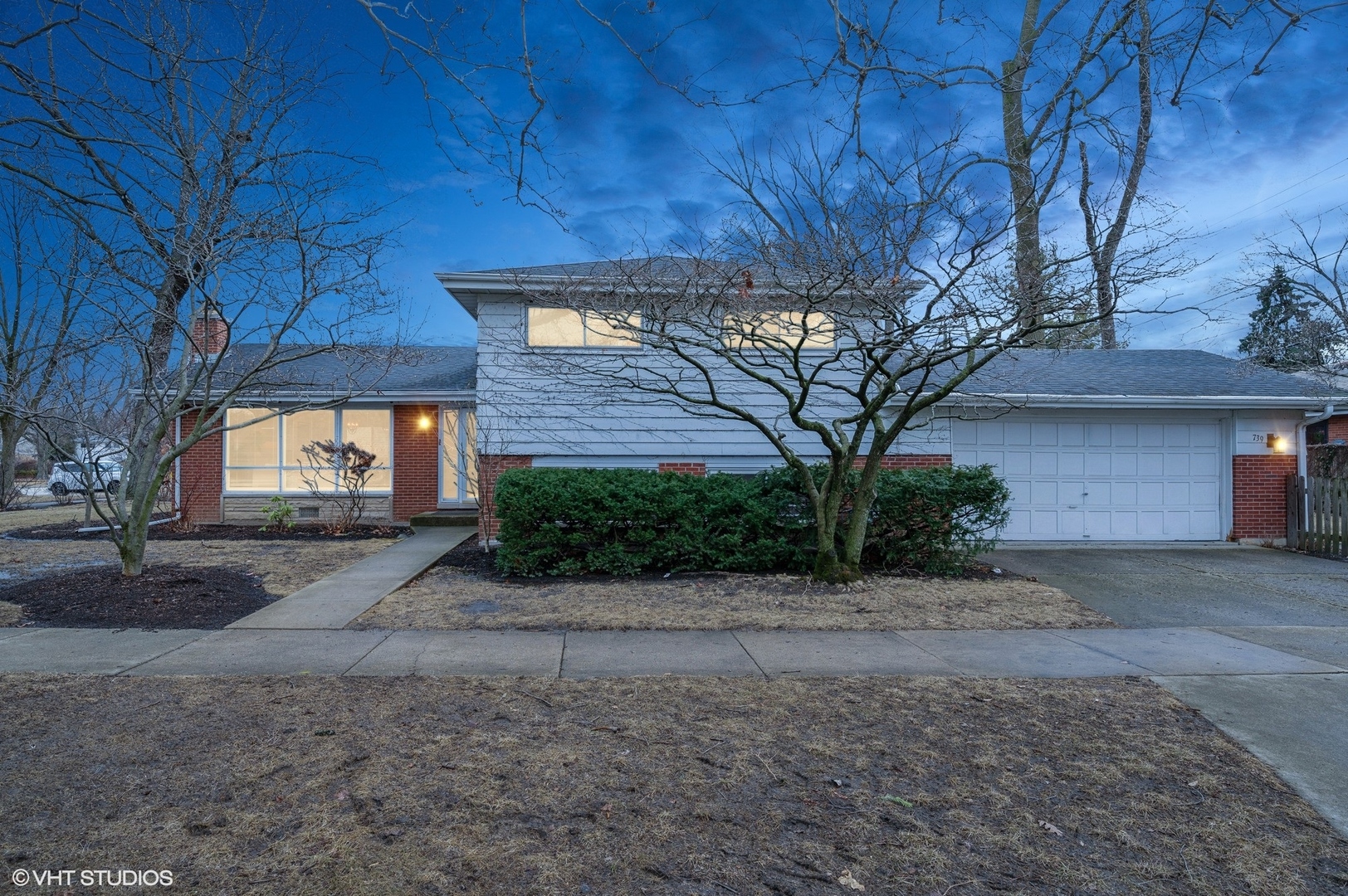 739 Echo Lane Glenview, IL 60025 - Photo 24 of 27 a front view of a house with a yard and garage