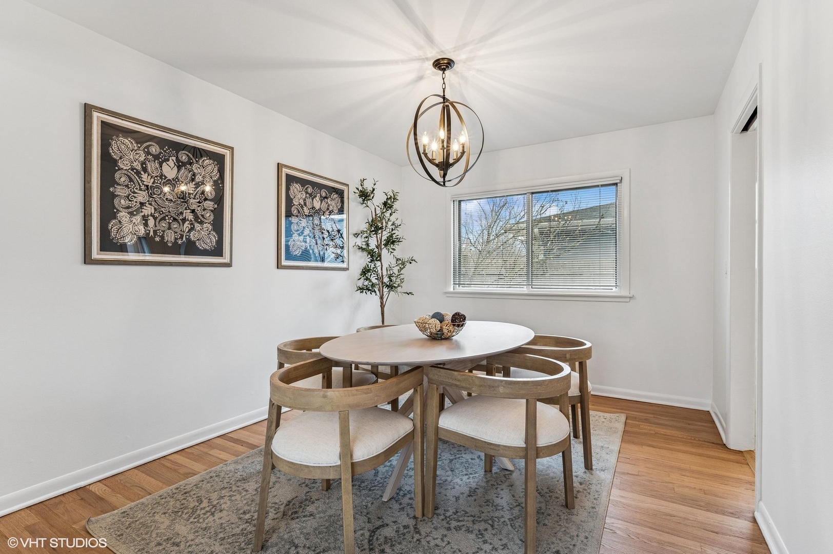 739 Echo Lane Glenview, IL 60025 - Photo 5 of 27 a view of a dining room with furniture wooden floor and a rug