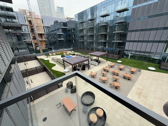 a room with gym equipment and large mirror