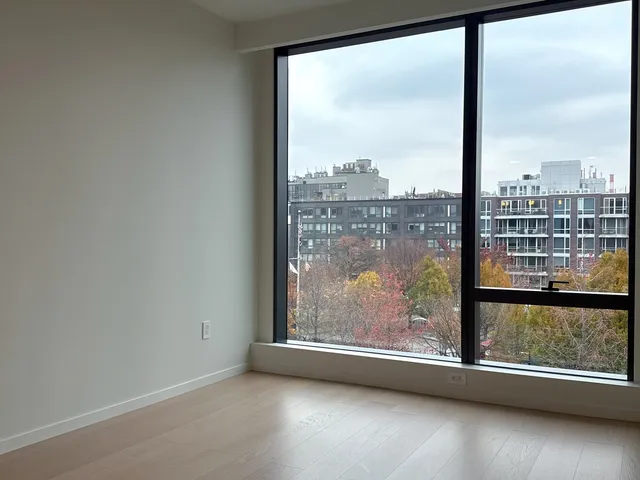 a view of a large window with wooden floor and a floor to ceiling window