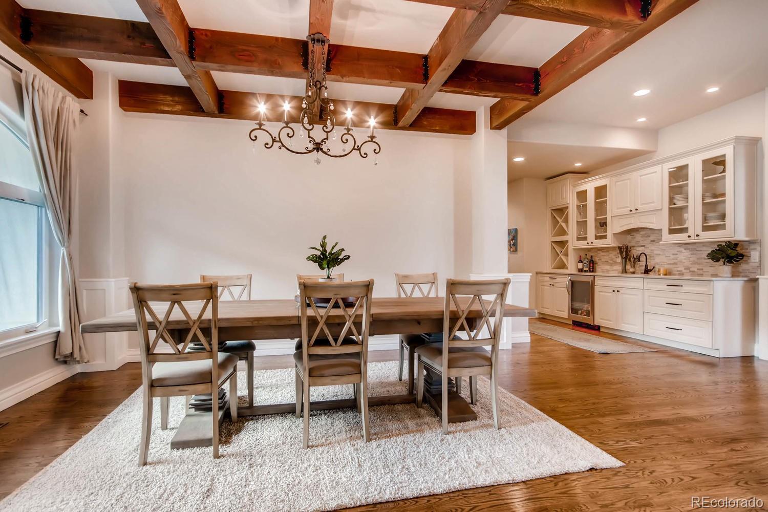 4880 Easley Road Golden, CO 80403 - Photo 11 of 40 a view of a dining room with furniture and wooden floor