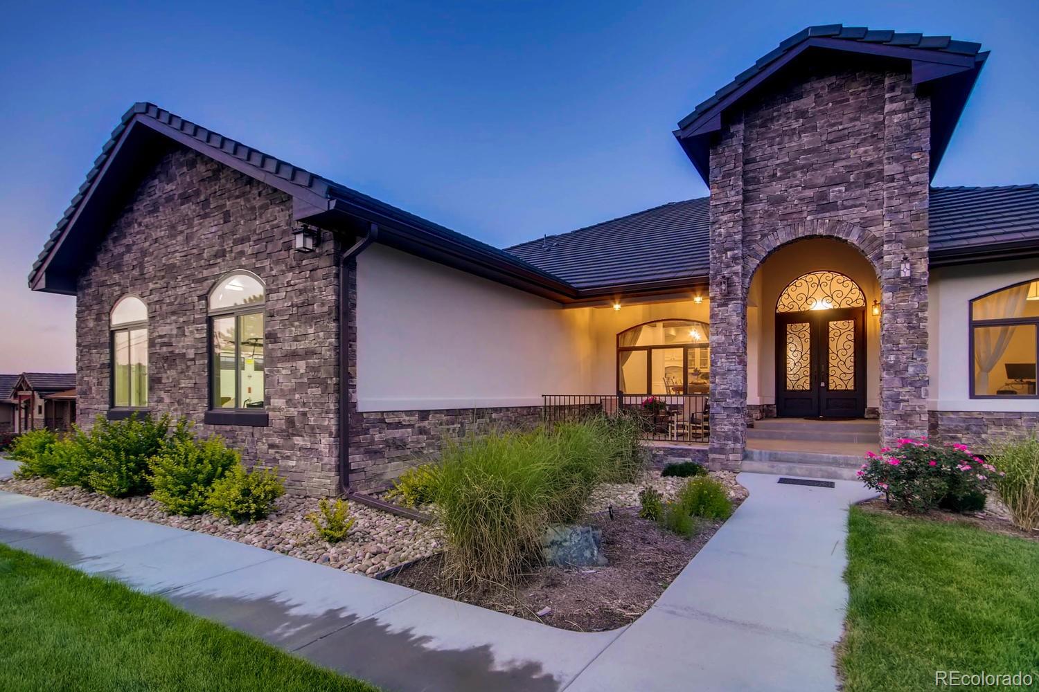 4880 Easley Road Golden, CO 80403 - Photo 2 of 40 a front view of a house with garden