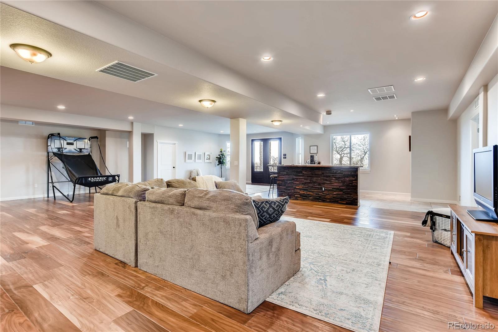 4880 Easley Road Golden, CO 80403 - Photo 21 of 40 a living room with furniture and a wooden floor