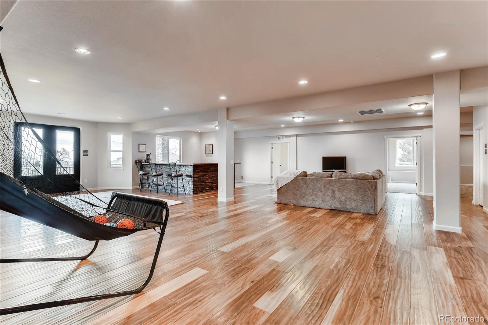 4880 Easley Road Golden, CO 80403 - Photo 22 of 40 a living room with furniture and a wooden floor