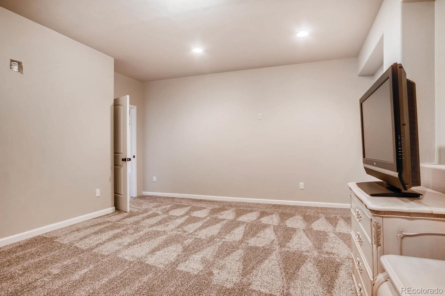 4880 Easley Road Golden, CO 80403 - Photo 26 of 40 a view of a room with a flat screen tv