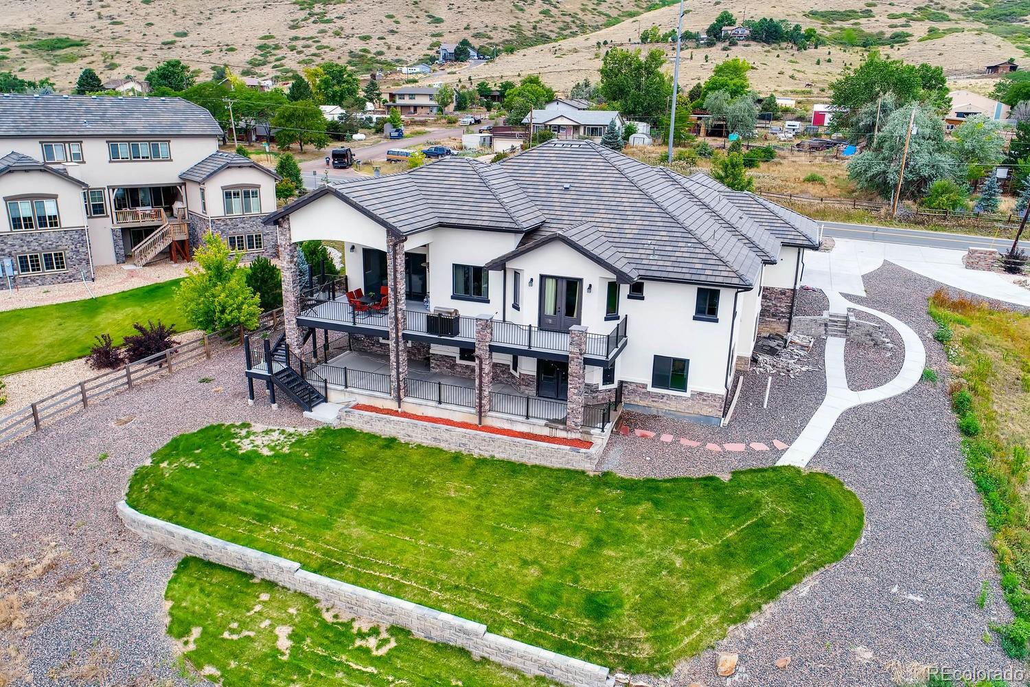 4880 Easley Road Golden, CO 80403 - Photo 30 of 40 an aerial view of a house with a garden and patio