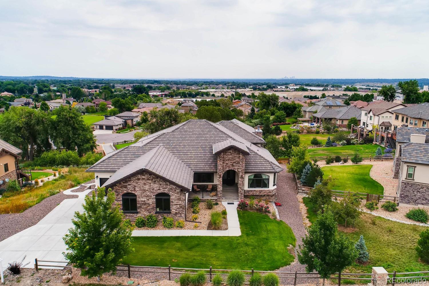 4880 Easley Road Golden, CO 80403 - Photo 3 of 40 an aerial view of a house with swimming pool and a yard