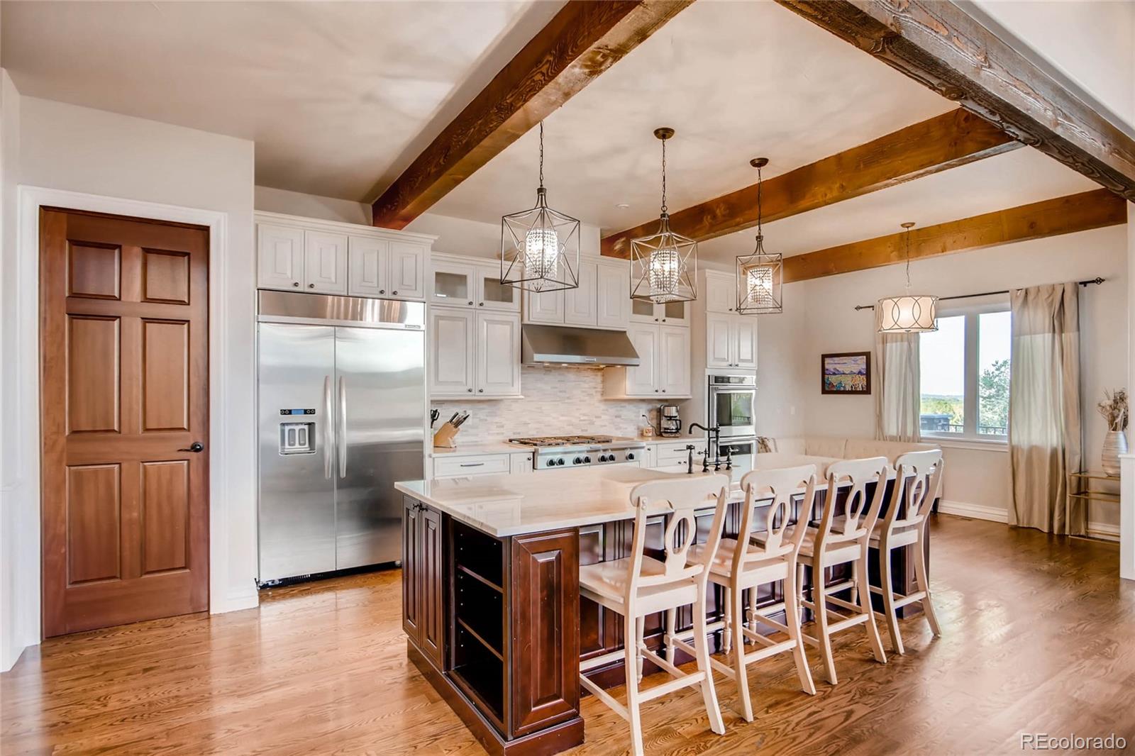 4880 Easley Road Golden, CO 80403 - Photo 7 of 40 a large kitchen with a table and chairs