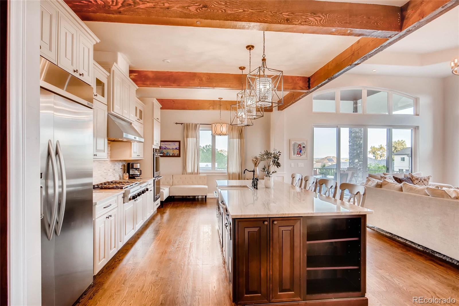 4880 Easley Road Golden, CO 80403 - Photo 8 of 40 a large kitchen with stainless steel appliances granite countertop a stove and a large window