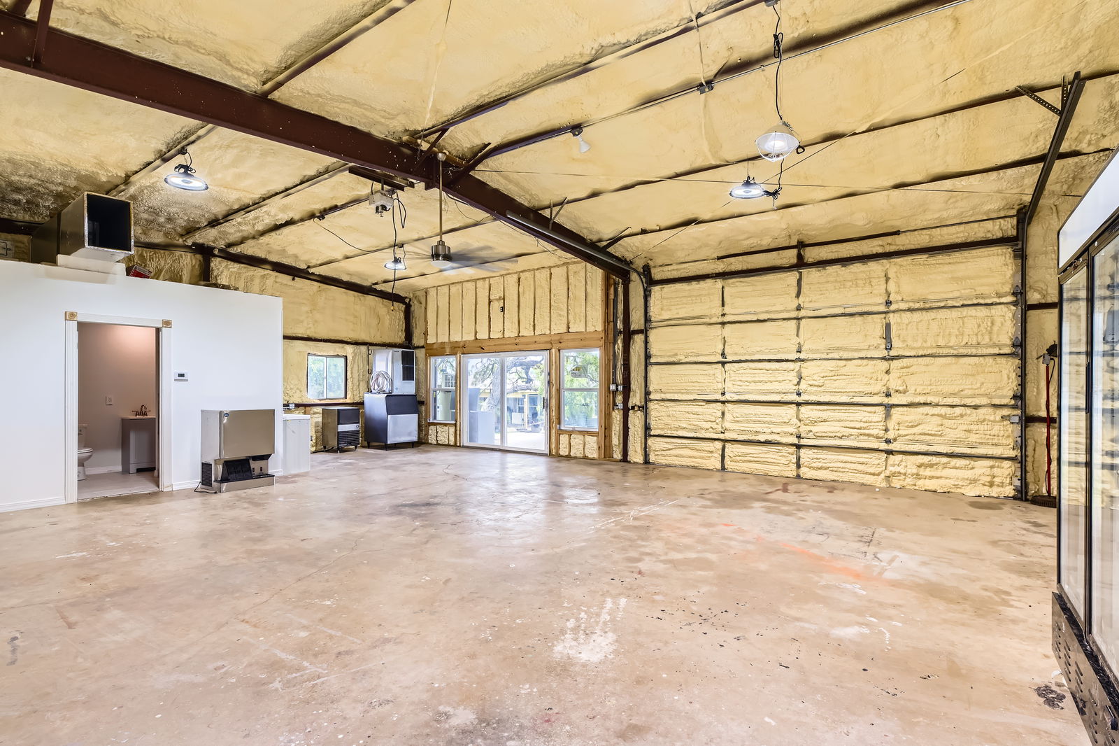 480 Grandpa Road Lockhart, TX 78644 - Photo 24 of 35 A ~1,200 sq ft workshop offers both utility and comfort, complete
with heating and cooling, foam insulation, a commercial sink, and a full bath, making it a dream space for work or
play