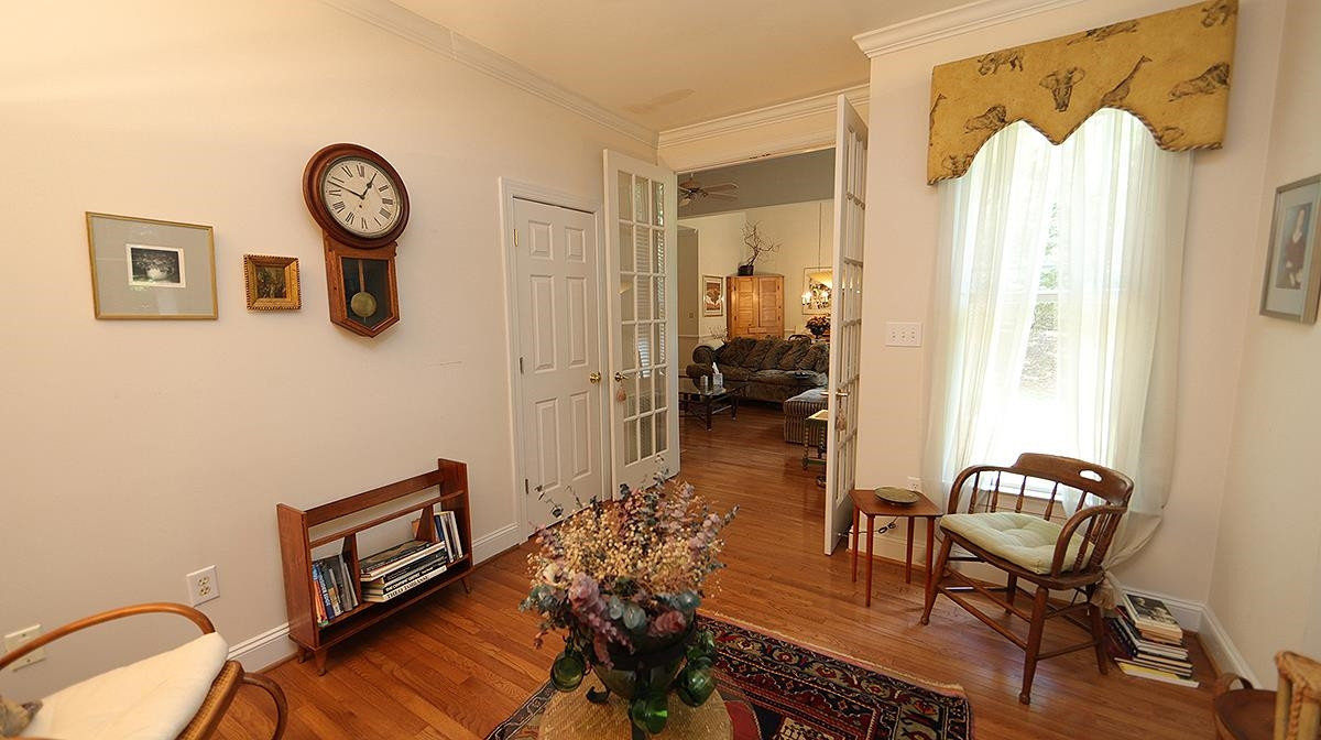 4802 Crestmore Road Raleigh, NC 27612 - Photo 14 of 25 with hardwood floors and closet can be 4th bedroom or living room Office