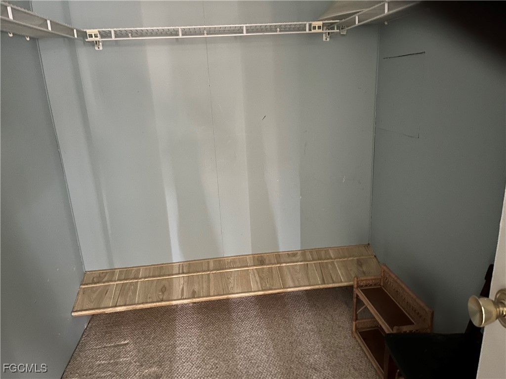 65 Sunset Circle North Fort Myers, FL 33903 - Photo 12 of 23 a view of a room with racks on the wall