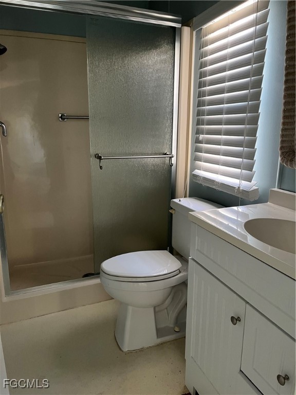 65 Sunset Circle North Fort Myers, FL 33903 - Photo 15 of 23 a bathroom with a sink a toilet and shower