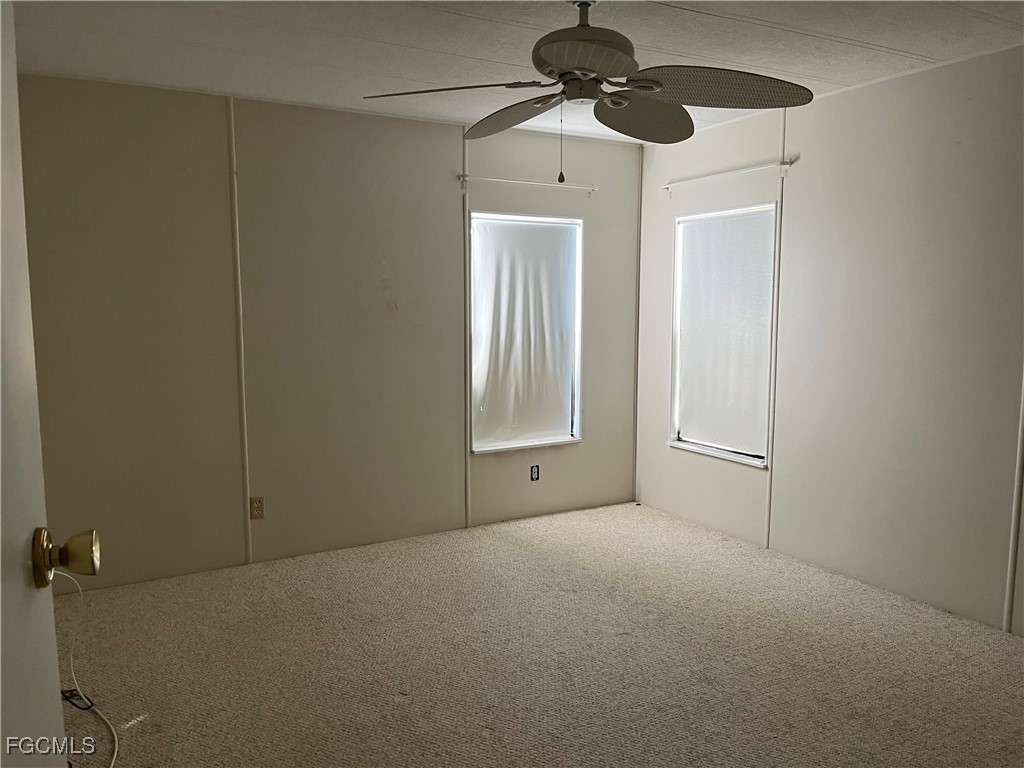 65 Sunset Circle North Fort Myers, FL 33903 - Photo 18 of 23 a view of an empty room with a window