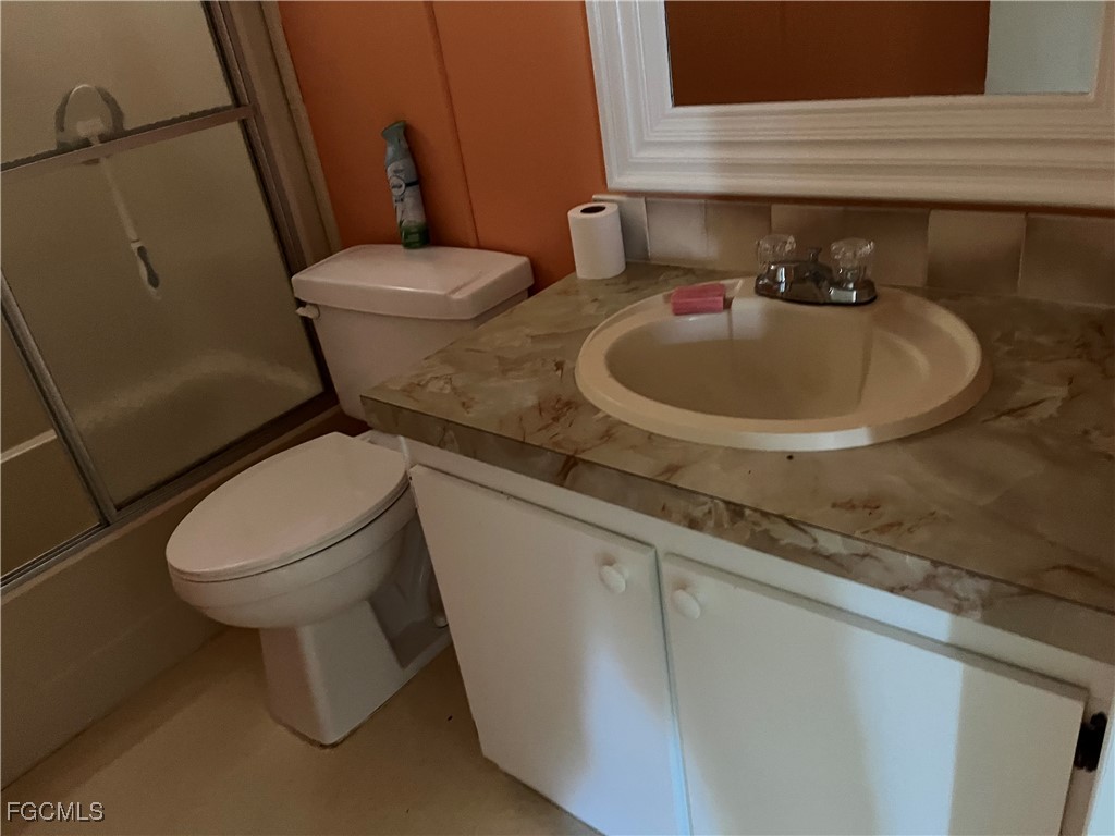 65 Sunset Circle North Fort Myers, FL 33903 - Photo 19 of 23 a bathroom with a sink and a toilet