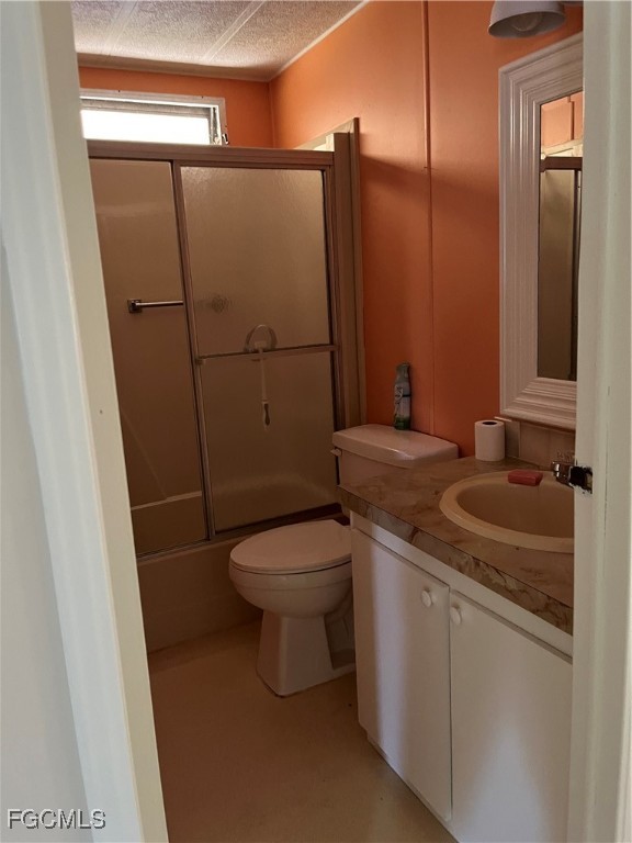65 Sunset Circle North Fort Myers, FL 33903 - Photo 20 of 23 a bathroom with a sink a toilet and shower