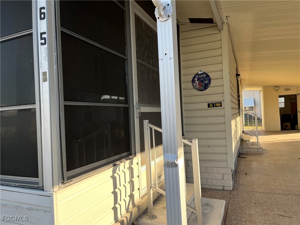 65 Sunset Circle North Fort Myers, FL 33903 - Photo 2 of 23 a view of a balcony with a door
