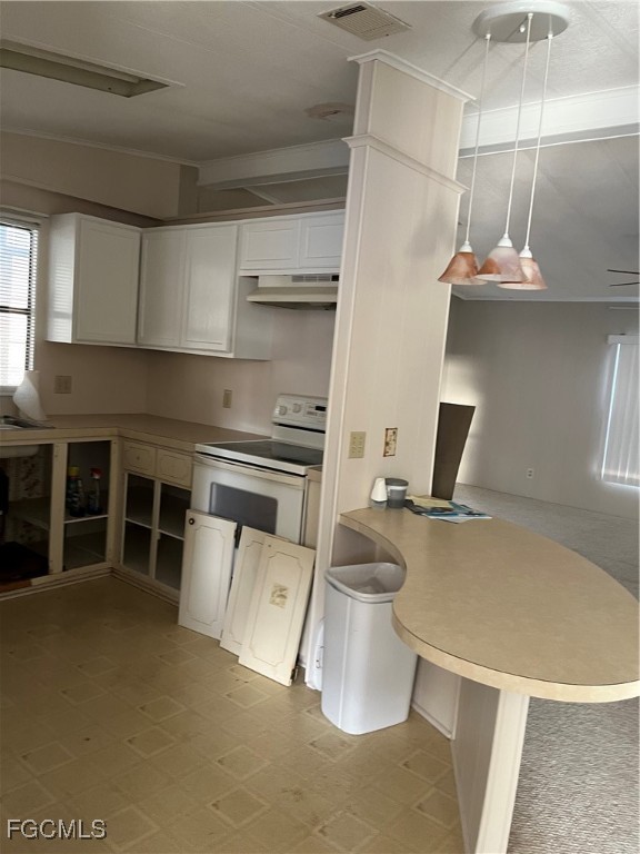 65 Sunset Circle North Fort Myers, FL 33903 - Photo 4 of 23 a kitchen with a stove and a refrigerator