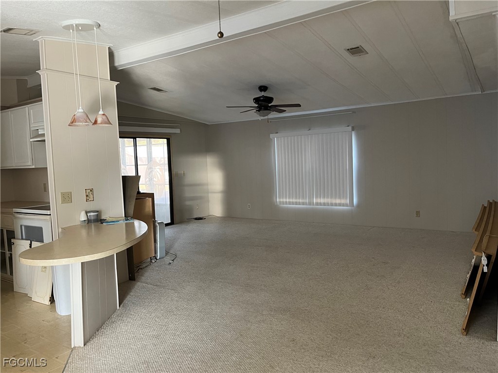 65 Sunset Circle North Fort Myers, FL 33903 - Photo 6 of 23 a large room with lots of counter space and windows