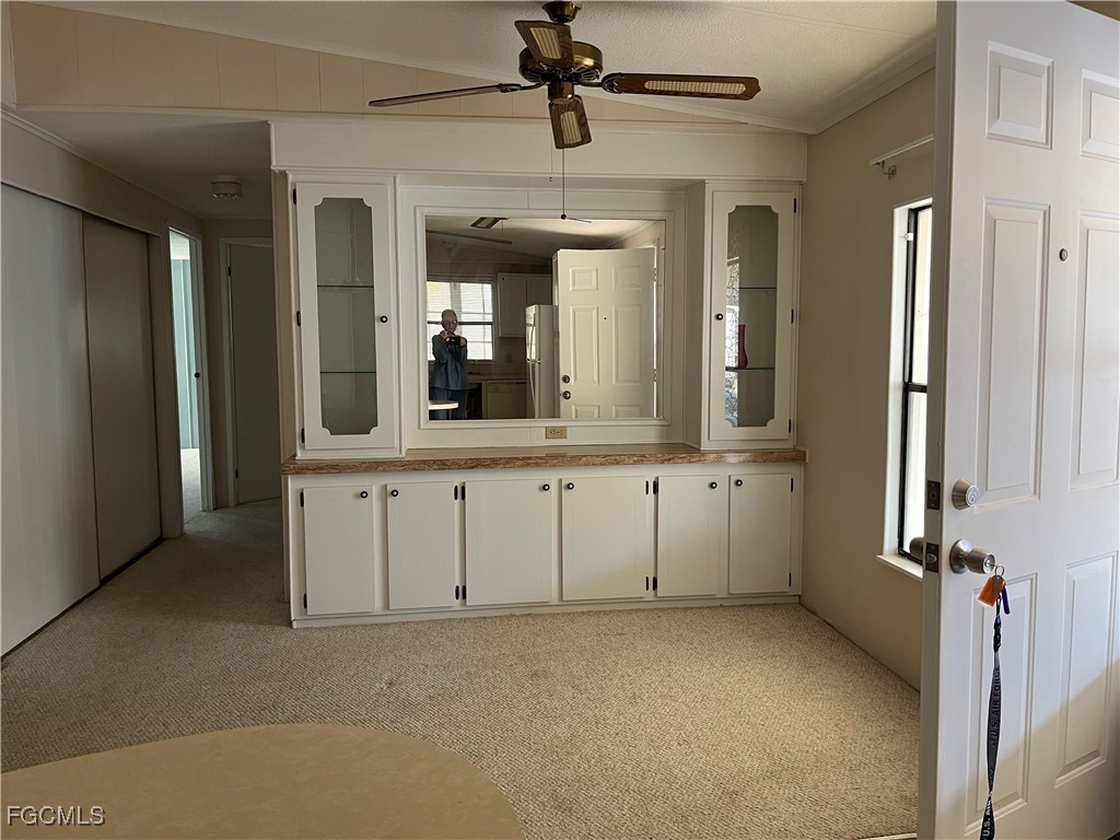 65 Sunset Circle North Fort Myers, FL 33903 - Photo 9 of 23 wooden floor with chandelier and window