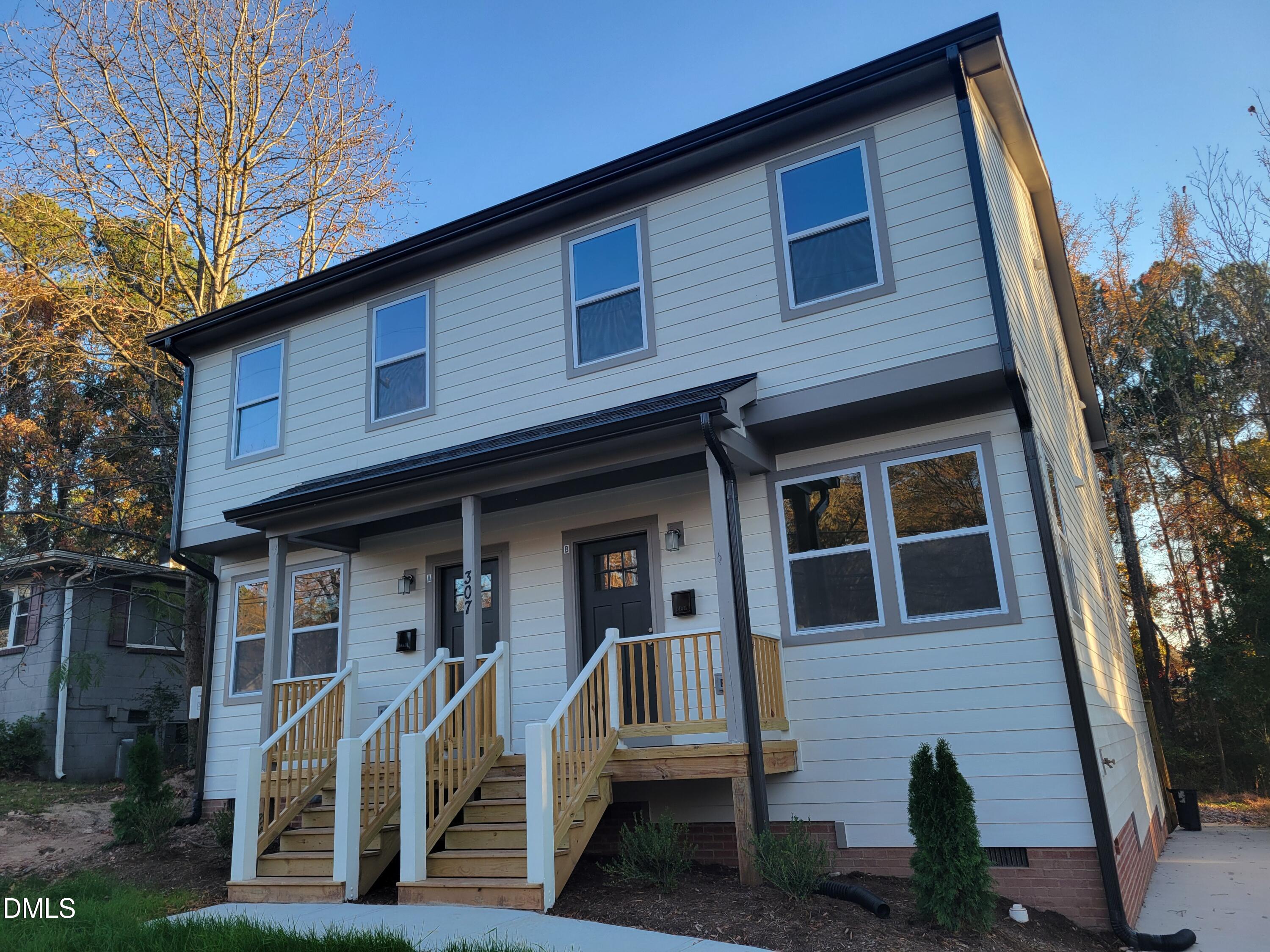 307 East End Avenue Durham, NC 27703 - Photo 1 of 22 a front view of a house with stairs