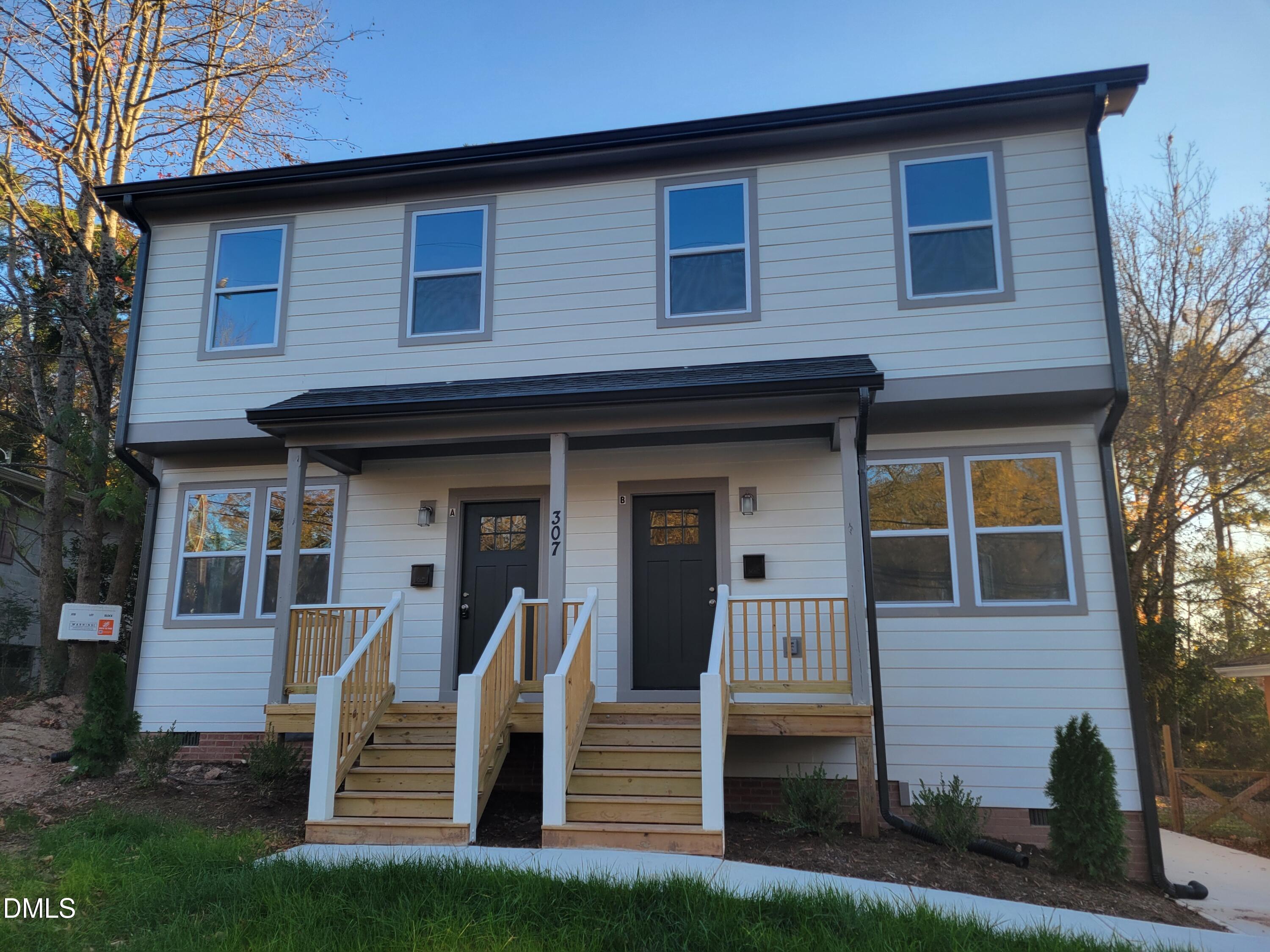 307 East End Avenue Durham, NC 27703 - Photo 11 of 22 a front view of a house with a yard