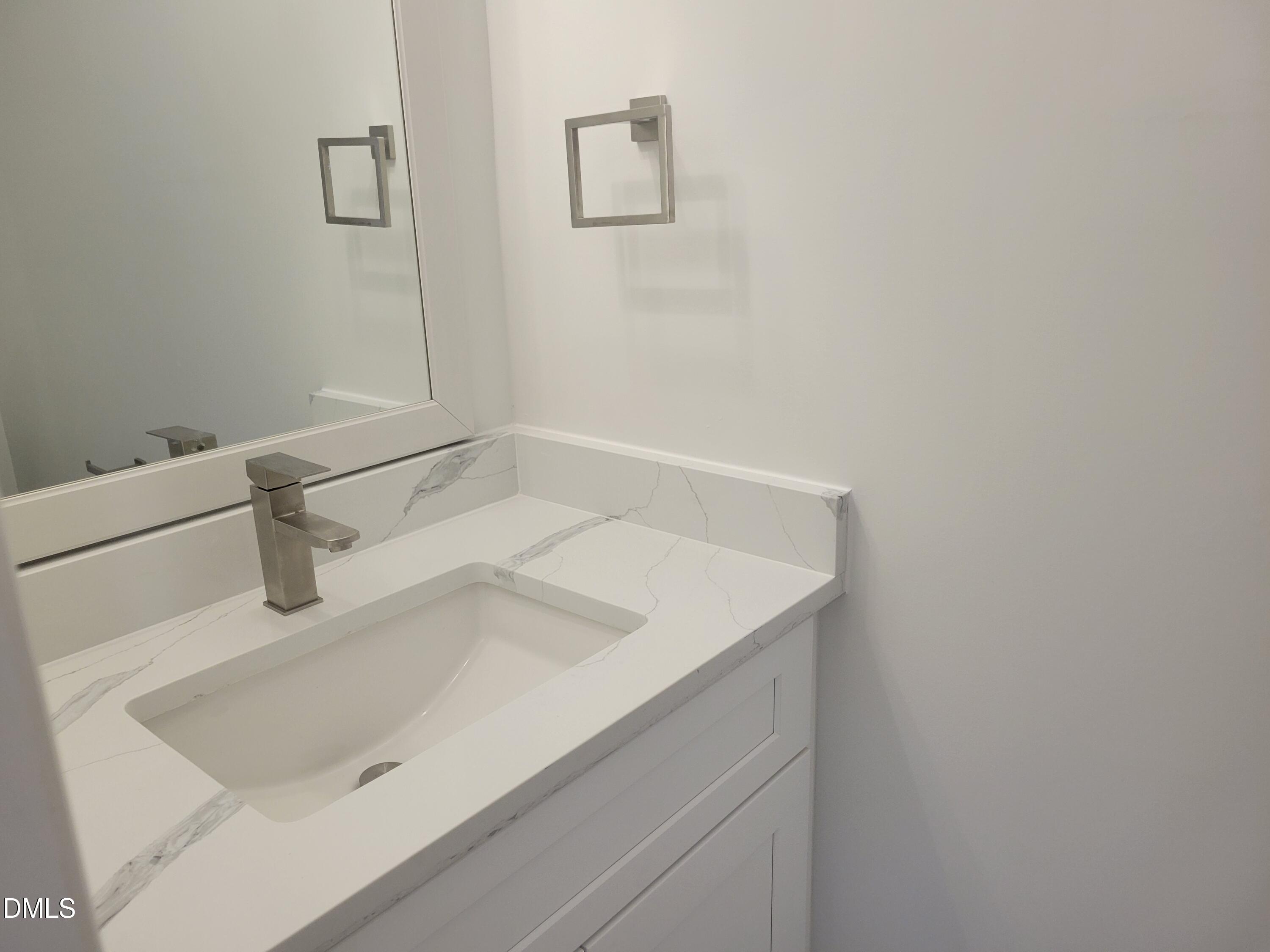 307 East End Avenue Durham, NC 27703 - Photo 17 of 22 a bathroom with a sink and a mirror