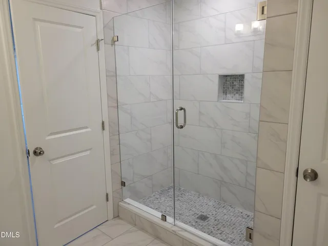 a bathroom with a granite countertop sink a toilet and a mirror