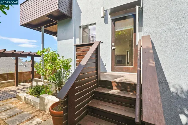 a kitchen with stainless steel appliances a refrigerator sink and stove