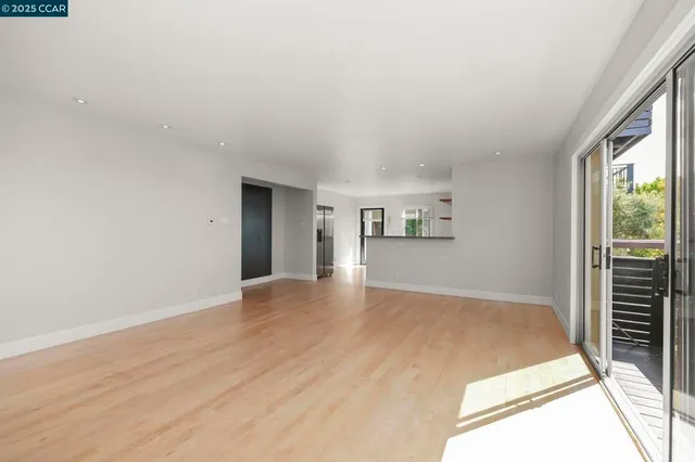 a kitchen with stainless steel appliances a sink and a refrigerator