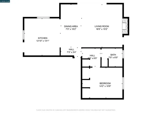 wooden floor fireplace and windows in an empty room