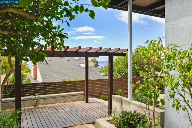 a view of a backyard with sitting area