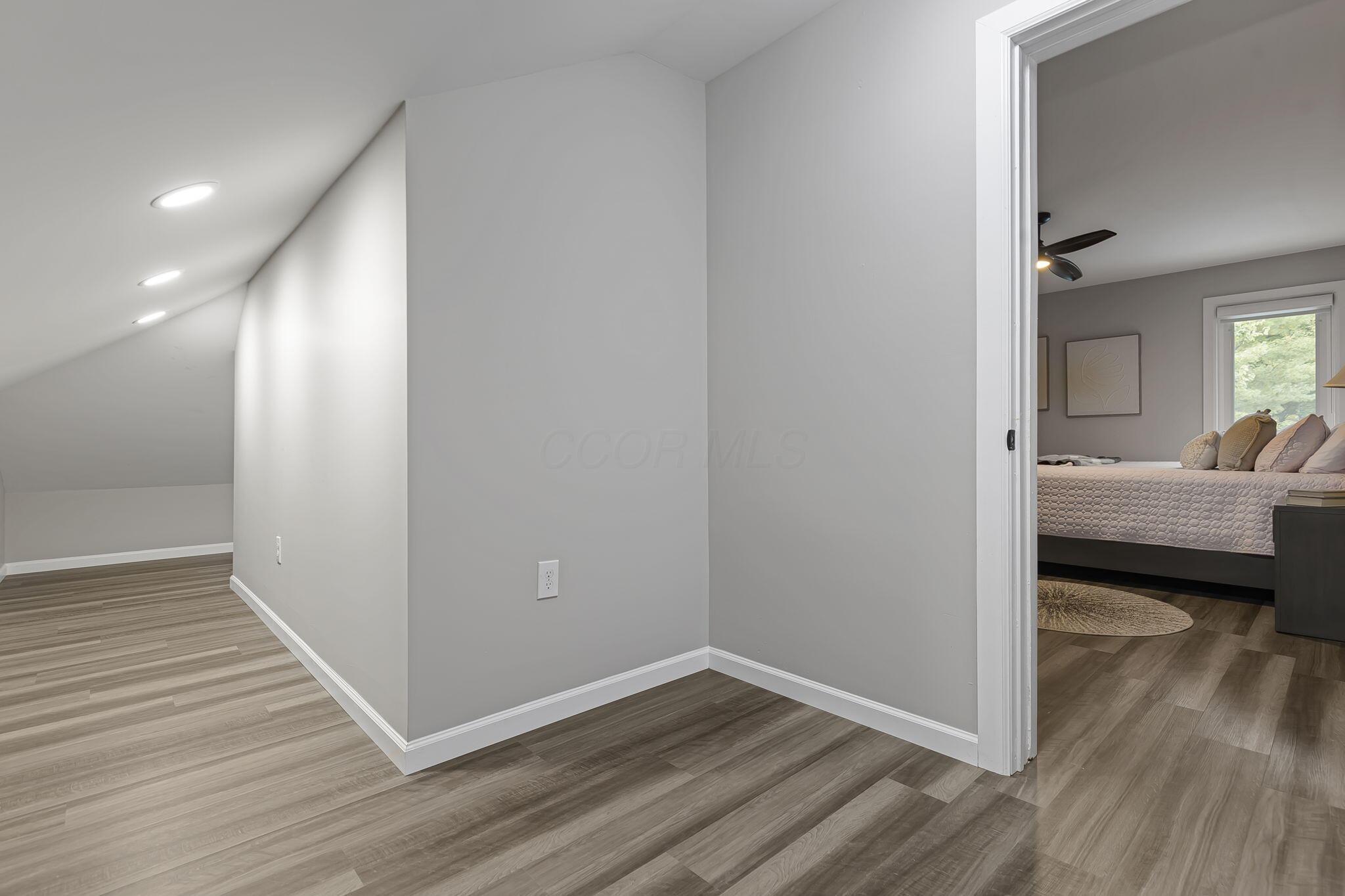 7140 Cook Road Powell, OH 43065 - Photo 75 of 87 Recessed lighting illuminates the space, featuring wood-finish flooring and a neutral color palette