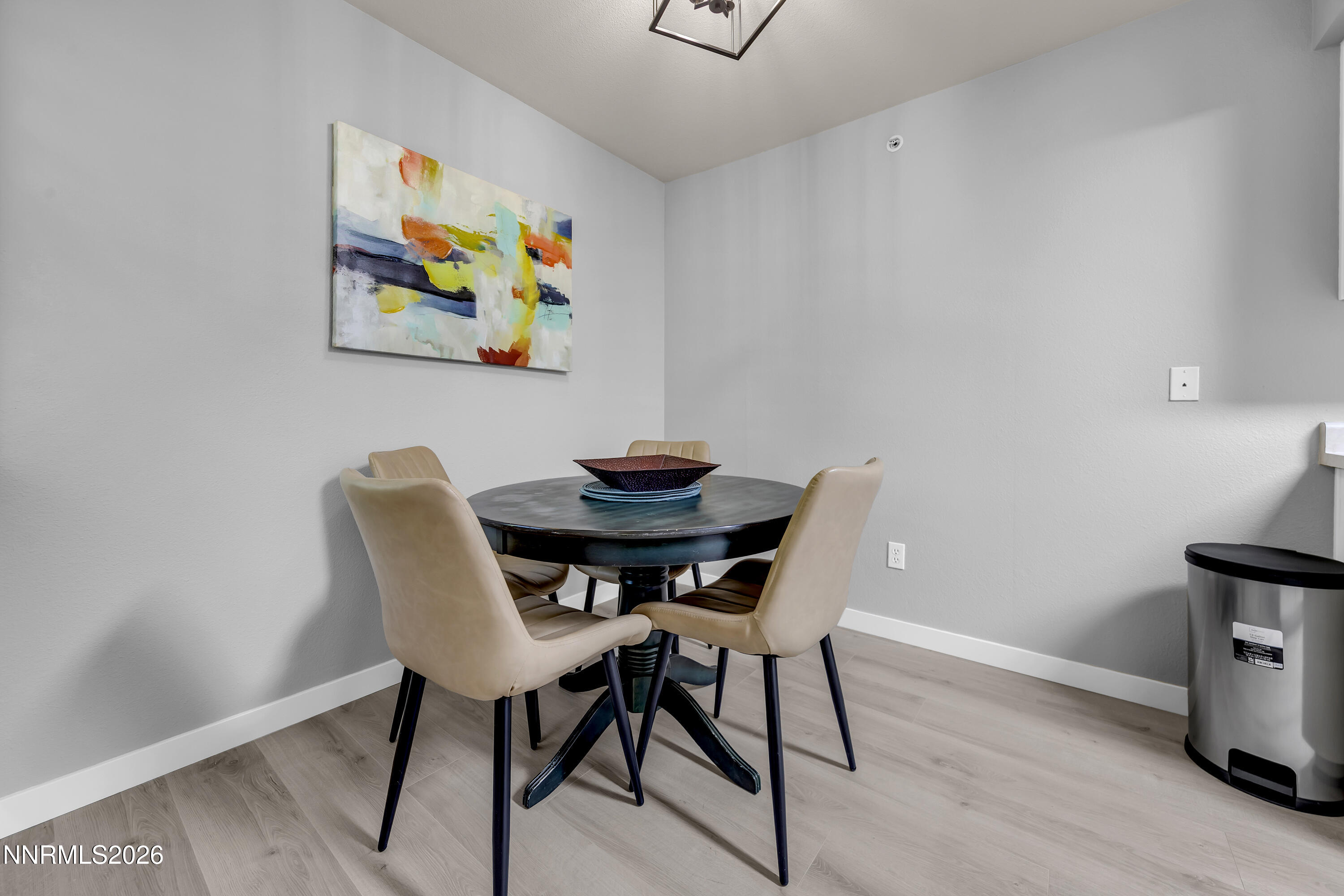 6850 Sharlands Avenue, Unit E 2022 Reno, NV 89523 - Photo 11 of 19 a view of a dining room with furniture and wooden floor