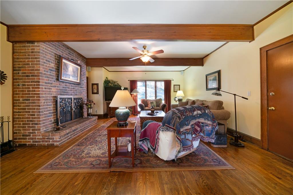 31 Coventry Drive Southeast Rome, GA 30161 - Photo 17 of 57 a living room with furniture a fireplace and a flat screen tv