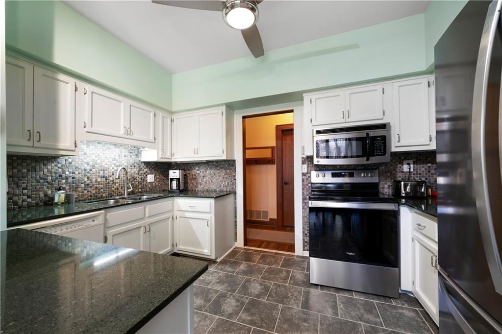 31 Coventry Drive Southeast Rome, GA 30161 - Photo 22 of 57 a kitchen with cabinets and stainless steel appliances