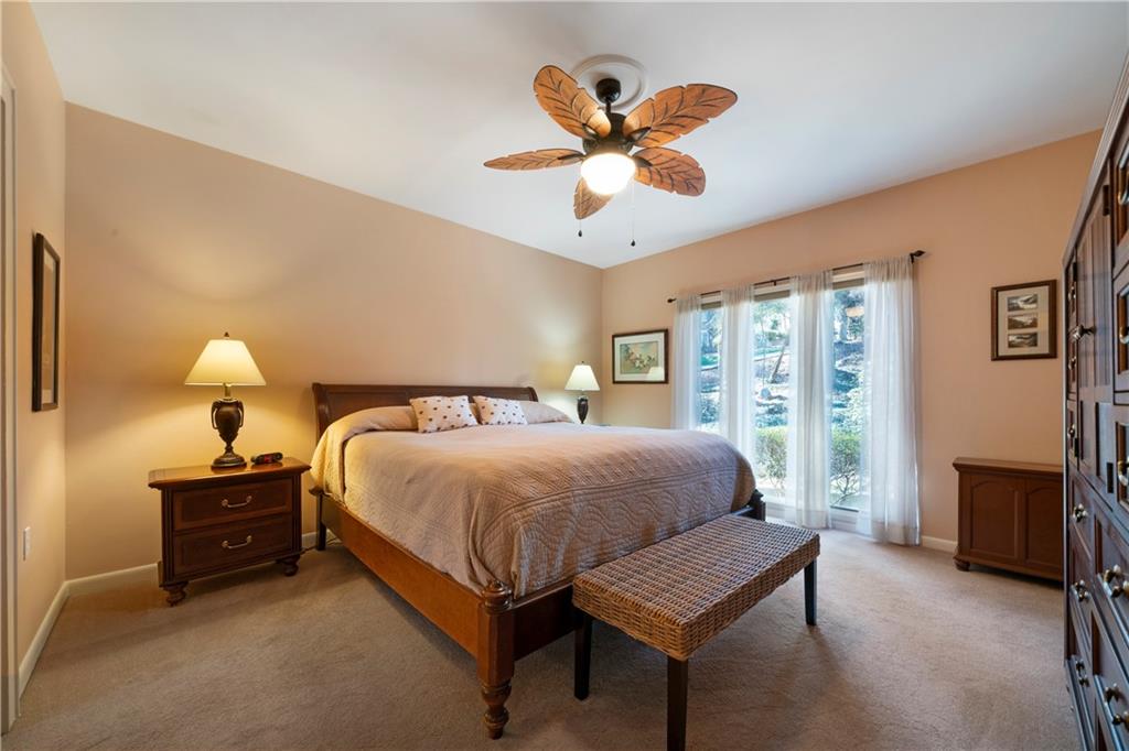 31 Coventry Drive Southeast Rome, GA 30161 - Photo 27 of 57 a bedroom with a bed and a chandelier