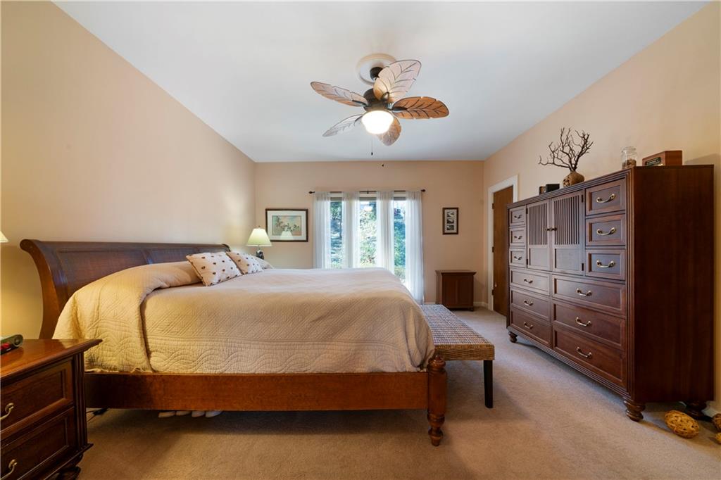 31 Coventry Drive Southeast Rome, GA 30161 - Photo 29 of 57 a bedroom with a bed and wooden floor