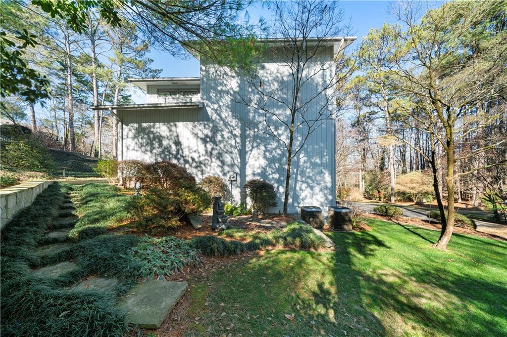 31 Coventry Drive Southeast Rome, GA 30161 - Photo 41 of 57 a view of backyard with table and chairs and potted plants