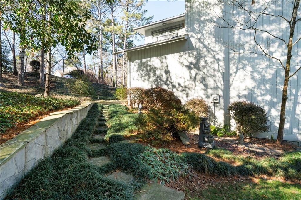 31 Coventry Drive Southeast Rome, GA 30161 - Photo 42 of 57 a view of a yard with plants and large trees