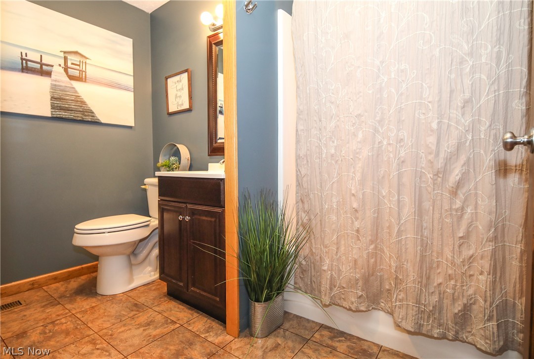 38610 Spiedel Town Road Bethesda, OH 43719 - Photo 18 of 33 Bathroom with vanity, tile patterned flooring, and toilet