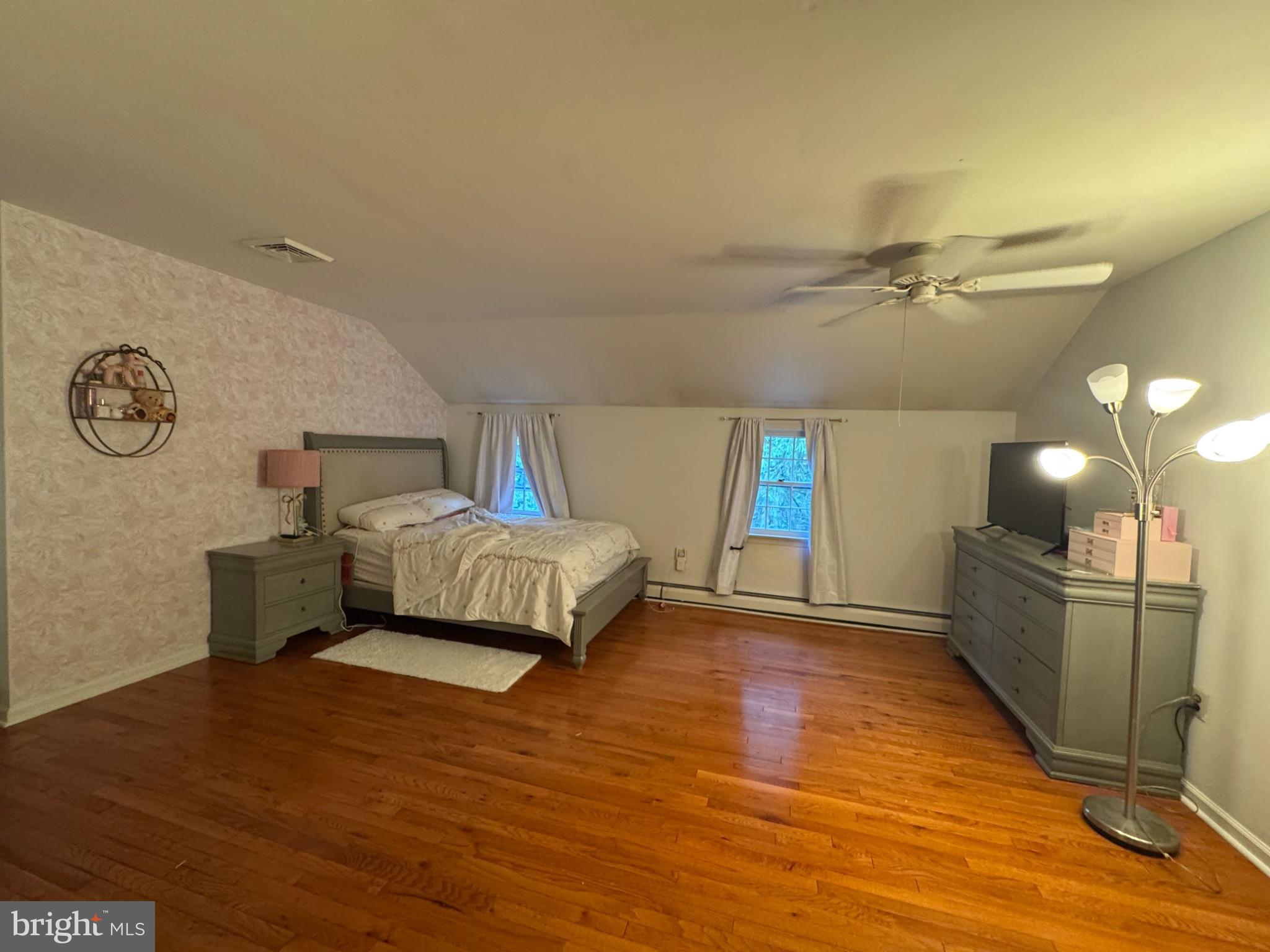2727 Durham Road Doylestown, PA 18902 - Photo 13 of 32 a bedroom with a bed and a chandelier