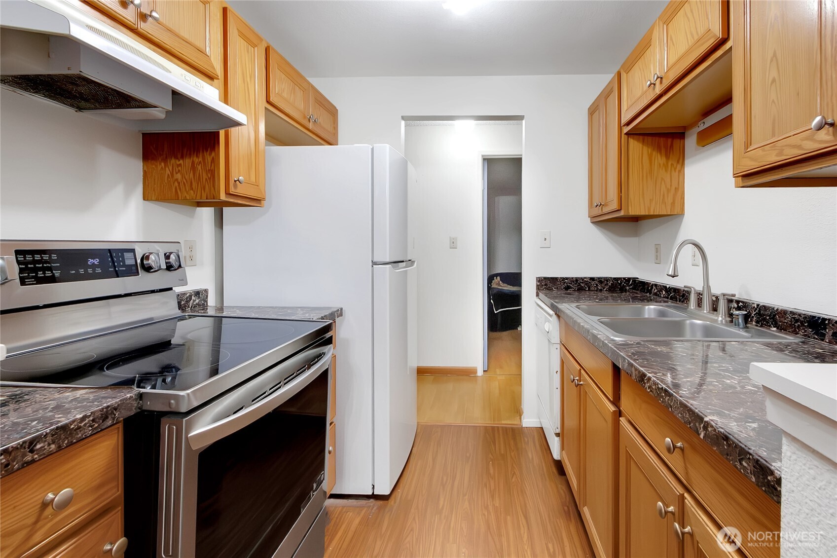 127 South 340th Street, Unit A Federal Way, WA 98003 - Photo 13 of 19 a kitchen with a sink stove and refrigerator