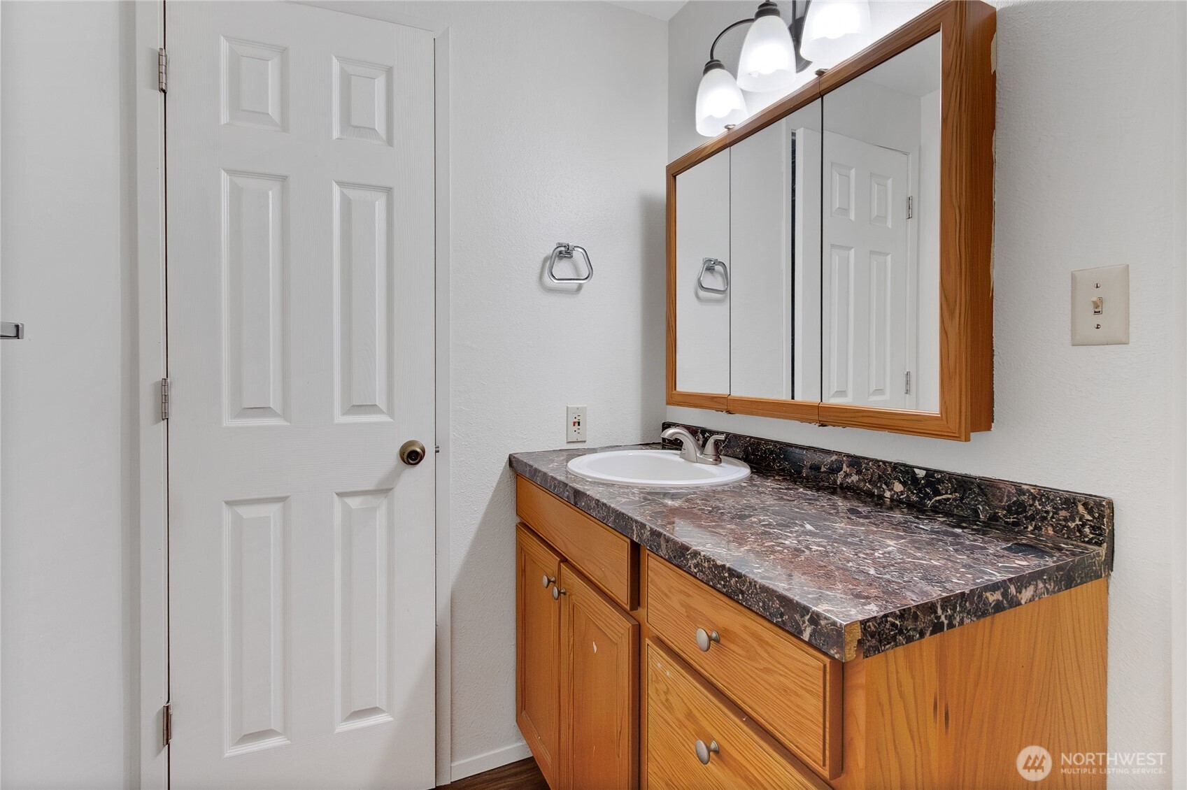 127 South 340th Street, Unit A Federal Way, WA 98003 - Photo 17 of 19 a bathroom with a granite countertop sink and a mirror