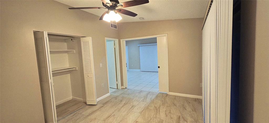 Undisclosed Address Miramar, FL 33025 - Photo 6 of 8 a view of an empty room with wooden floor