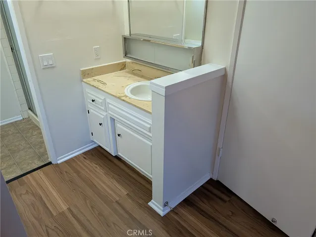 a bathroom with a sink and mirror