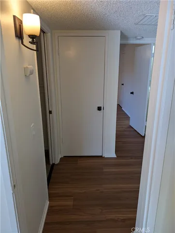 a view of a big house in a big yard with large trees